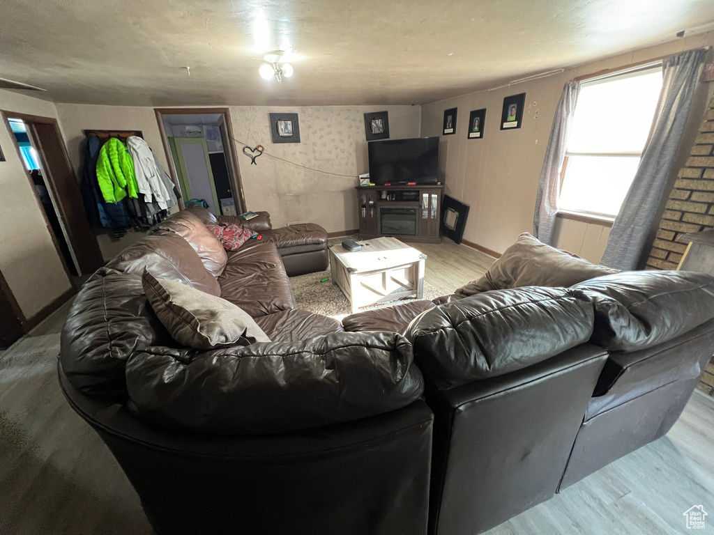 Living room with light wood finished floors and baseboards