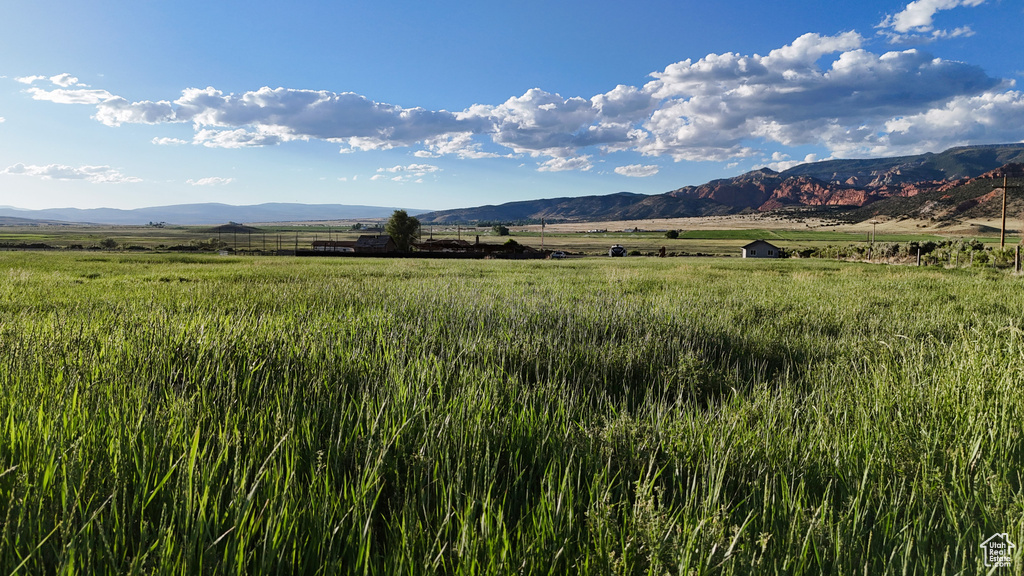 Property view of mountains with a rural view