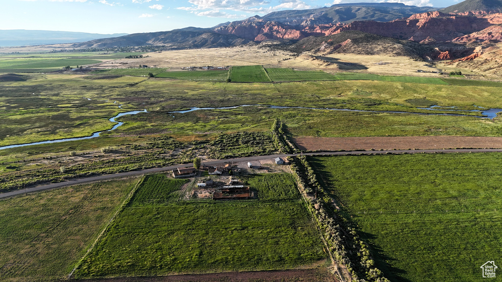 Birds eye view of property featuring a mountain view and a rural view