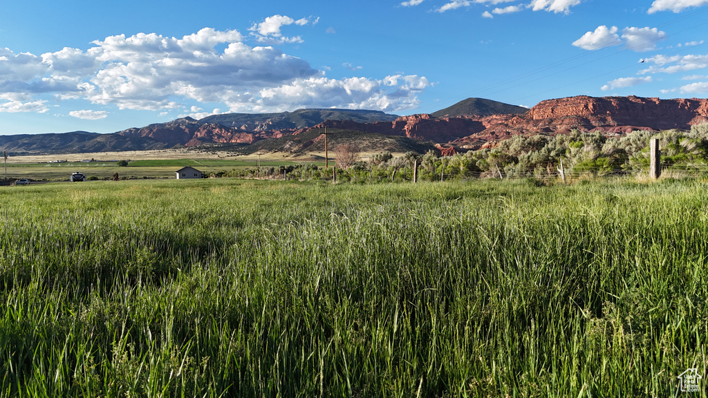 Property view of mountains with a rural view