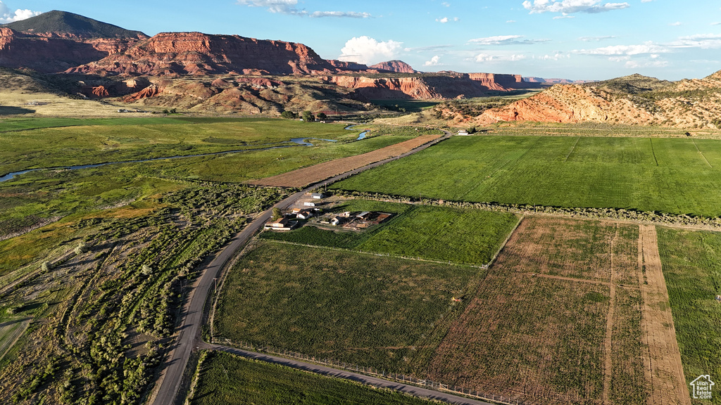 Birds eye view of property with a rural view and a mountain view