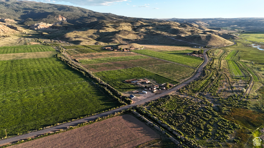 Drone / aerial view with a mountain view and a rural view