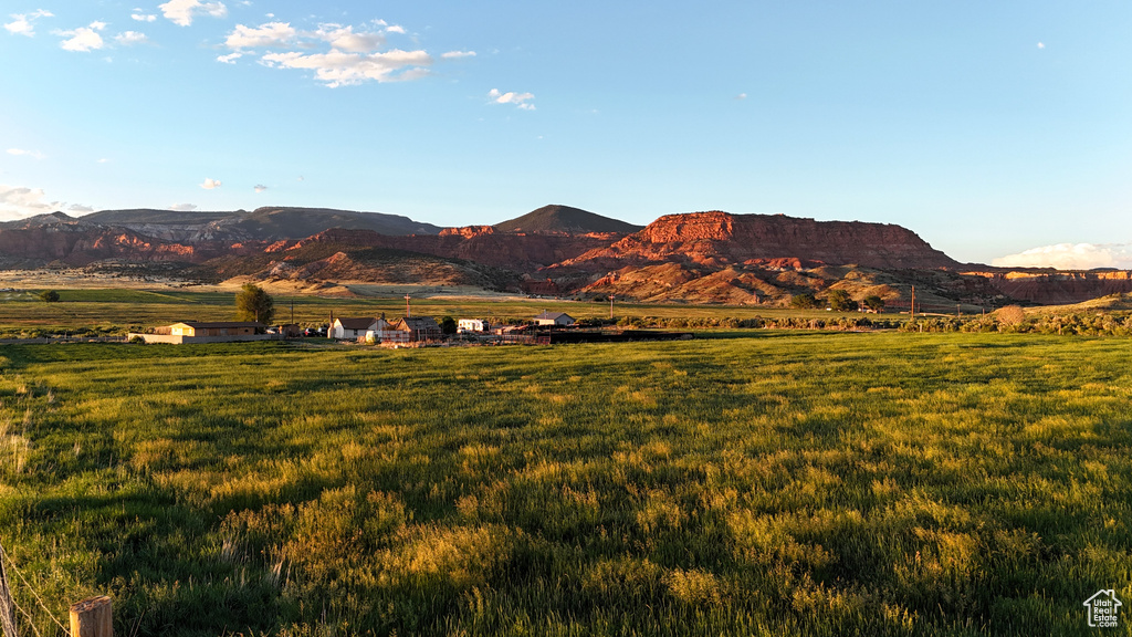 Property view of mountains with a rural view