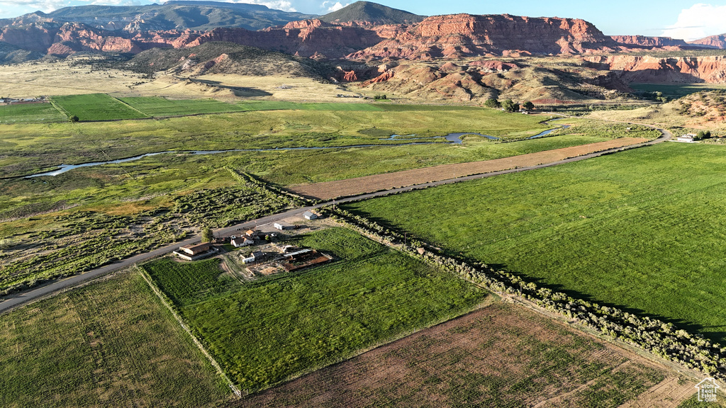 Birds eye view of property with a mountain view and a rural view