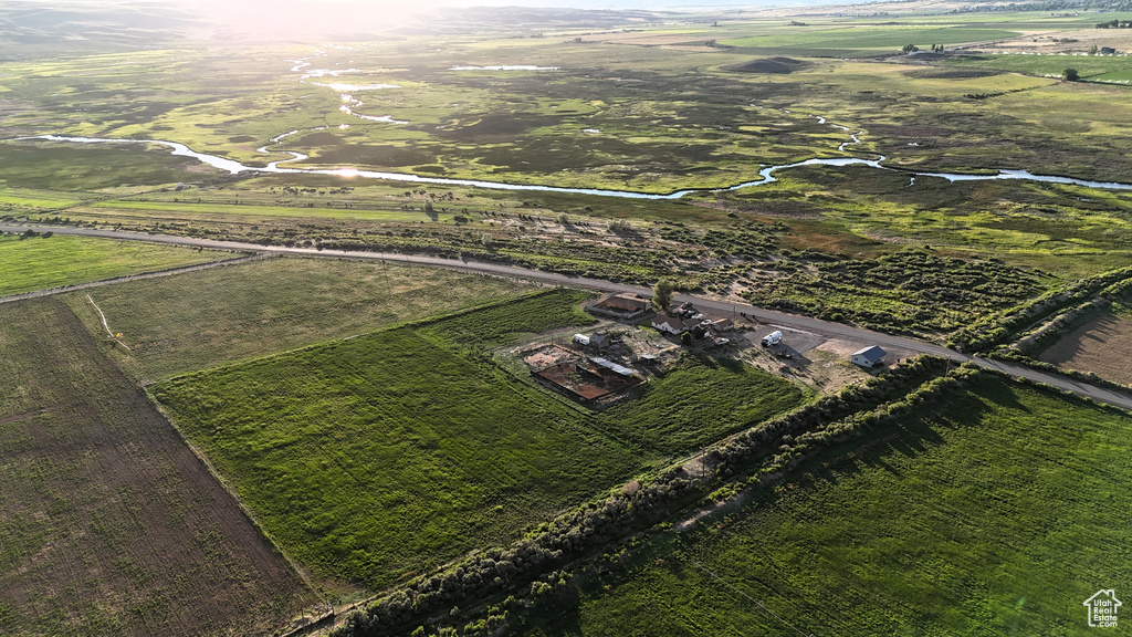 Birds eye view of property with a rural view