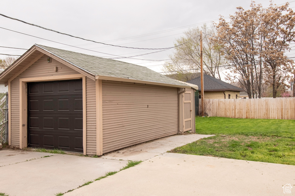 Garage featuring a yard