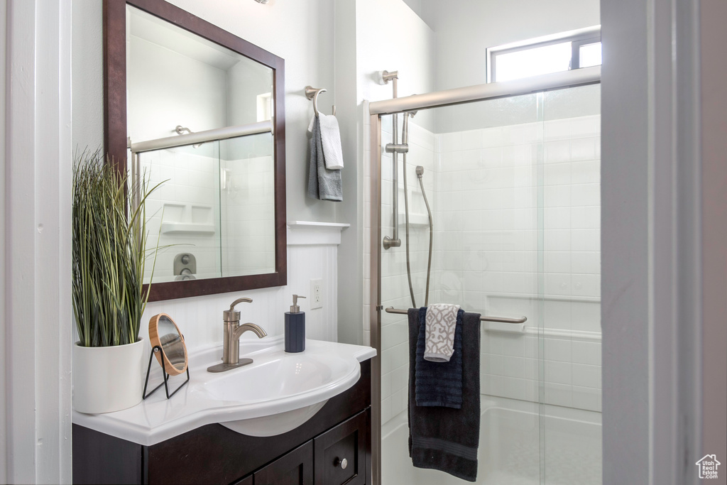 Bathroom with walk in shower and vanity