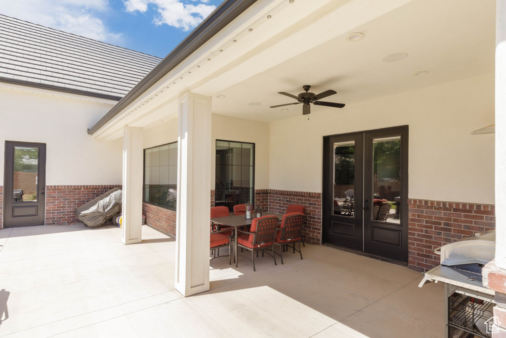 View of patio with french doors and ceiling fan