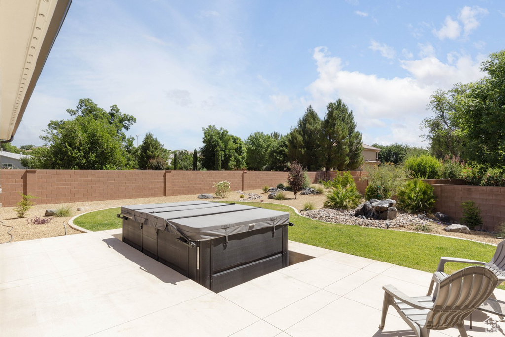 View of patio / terrace with a hot tub