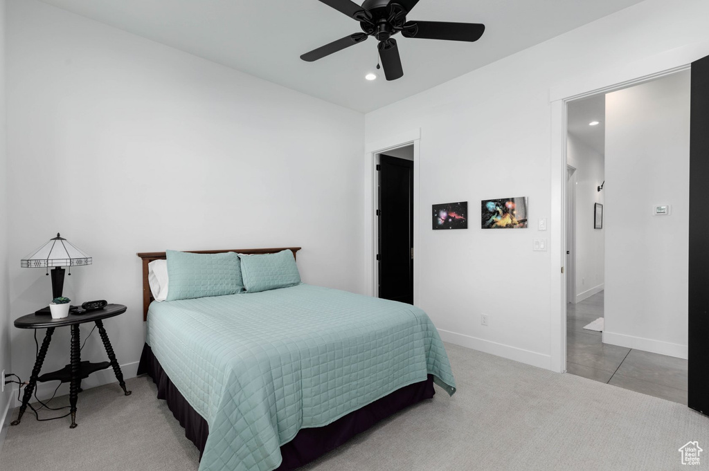 Bedroom featuring light tile patterned flooring and ceiling fan