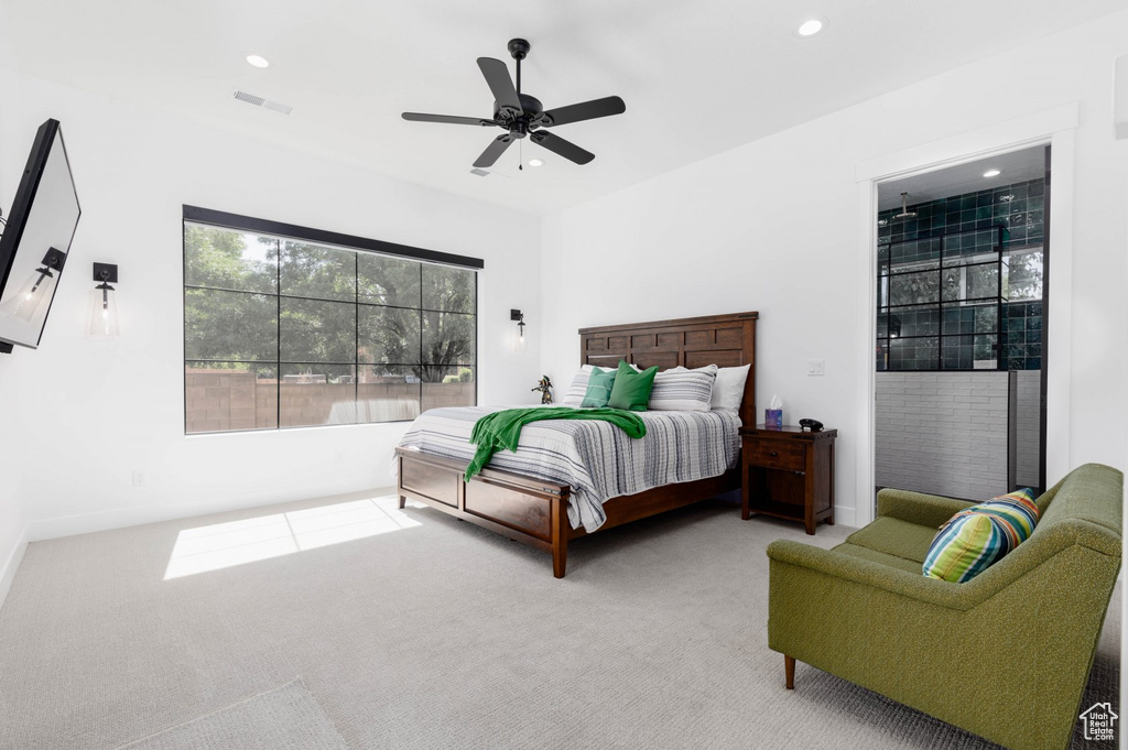 Bedroom featuring ceiling fan and carpet flooring