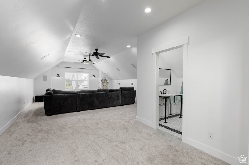 Carpeted bedroom with vaulted ceiling