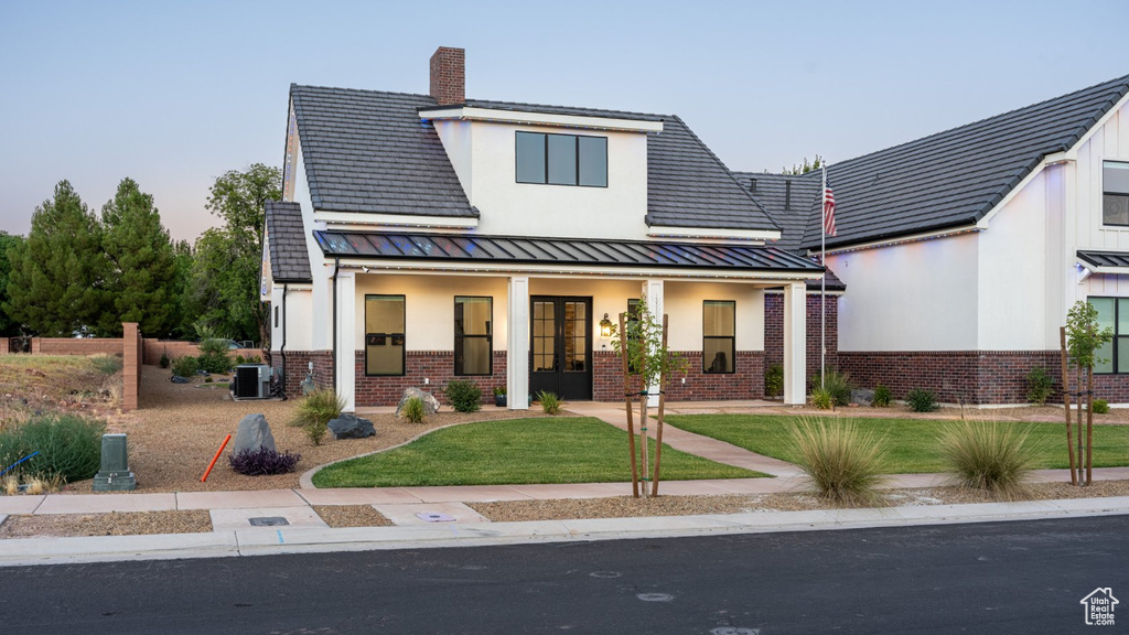 Modern farmhouse style home featuring central air condition unit