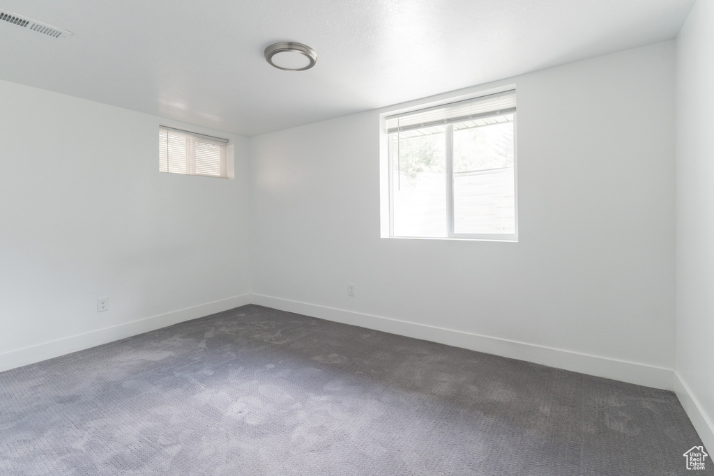 Empty room with carpet floors