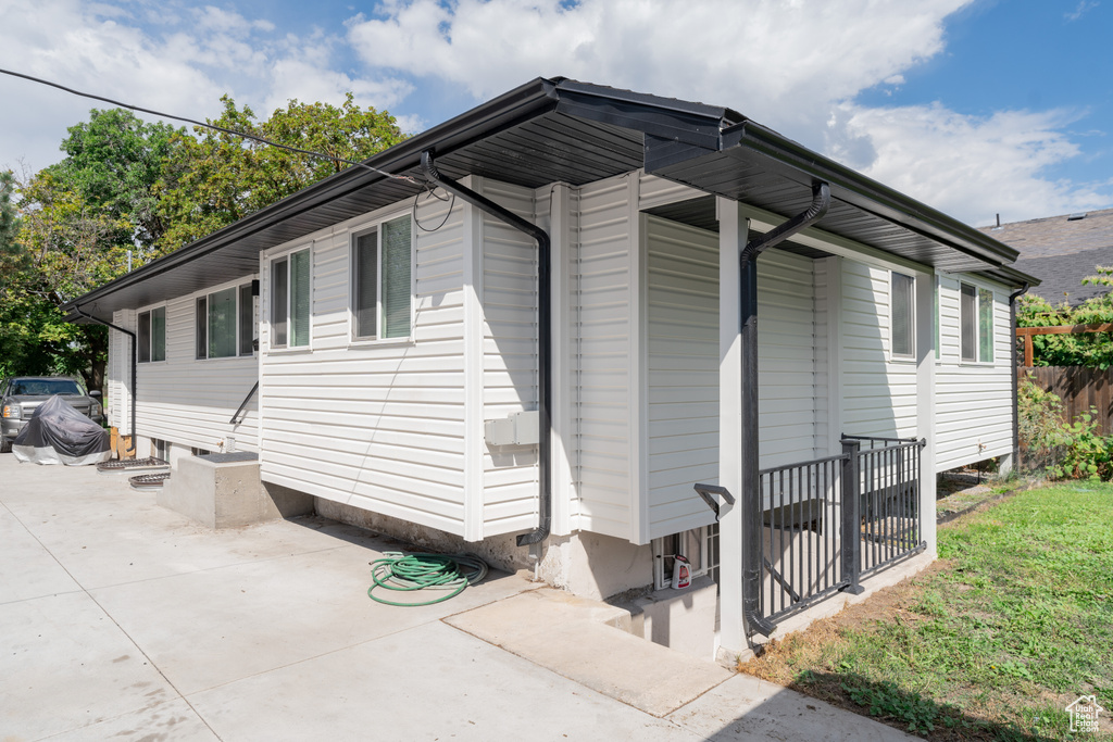 View of side of home featuring a patio