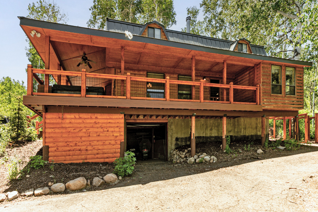 Back of house with ceiling fan