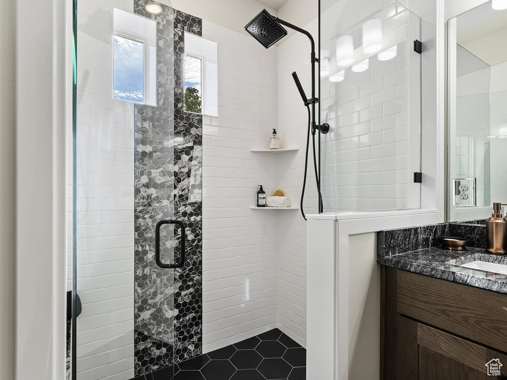 Bathroom featuring vanity and walk in shower