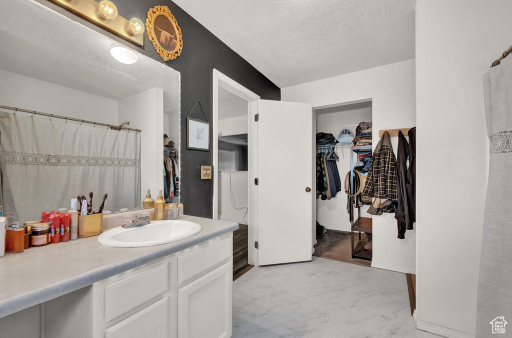 Bathroom featuring vanity and hardwood / wood-style flooring