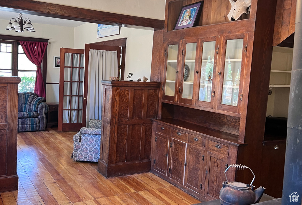 Interior space featuring light hardwood / wood-style flooring and an inviting chandelier