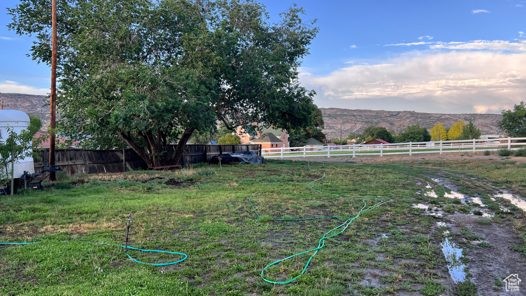 View of yard featuring a mountain view and a rural view