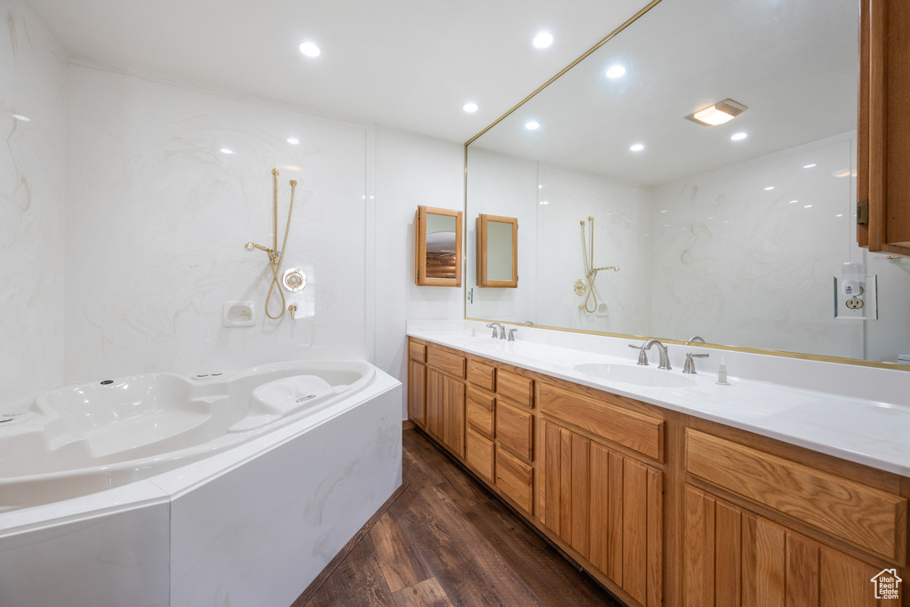 Bathroom with hardwood / wood-style floors and dual bowl vanity