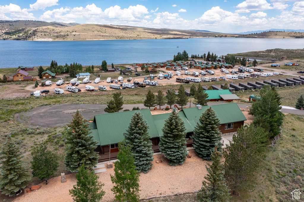 Drone / aerial view with a water and mountain view