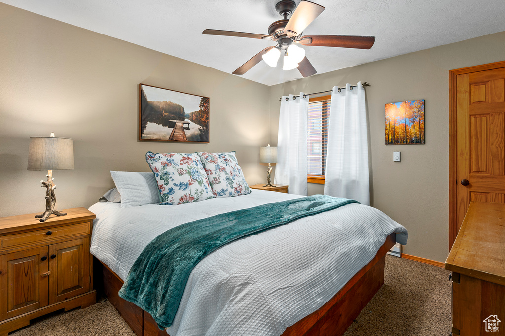 Bedroom with carpet floors and ceiling fan