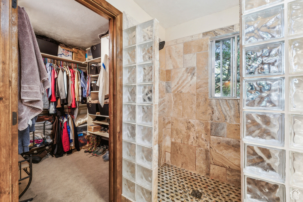 Bathroom featuring a tile shower