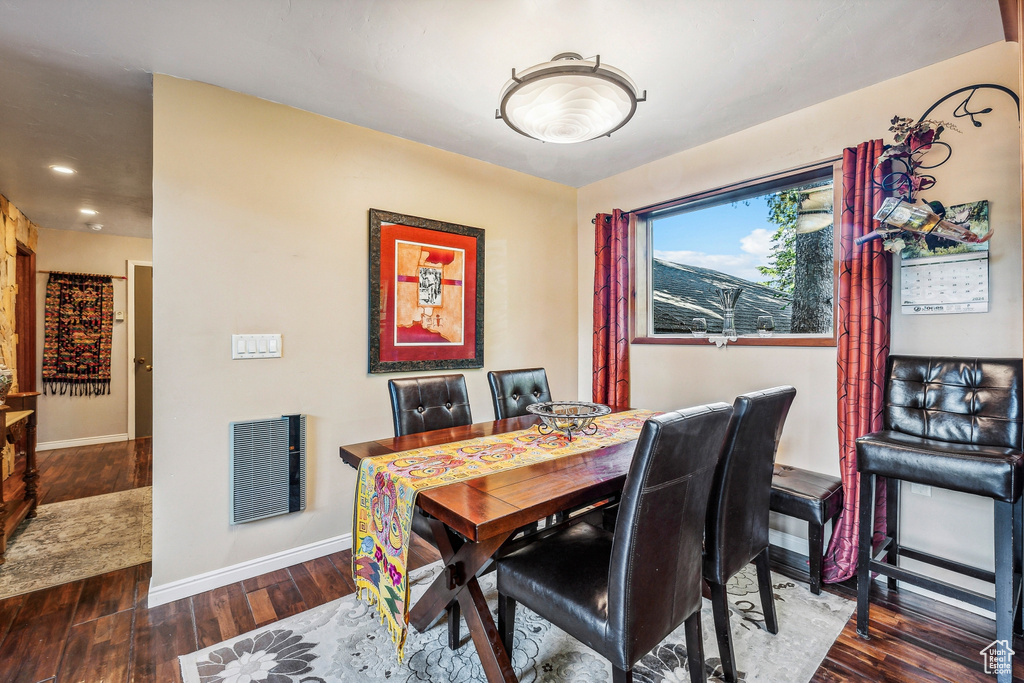 Dining area featuring dark hardwood / wood-style flooring