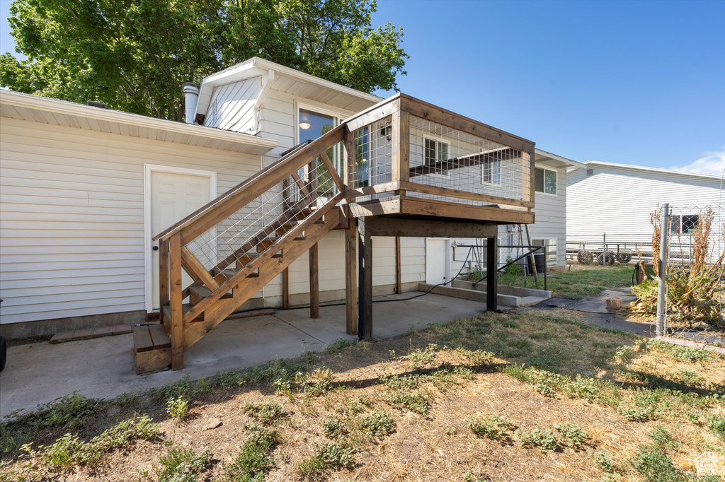 Rear view of property with a patio area