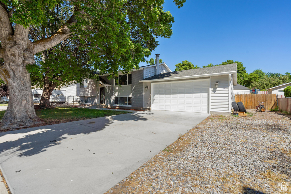 View of front facade featuring a garage