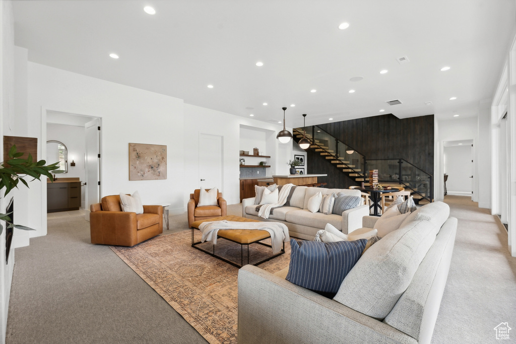 Living room featuring light carpet