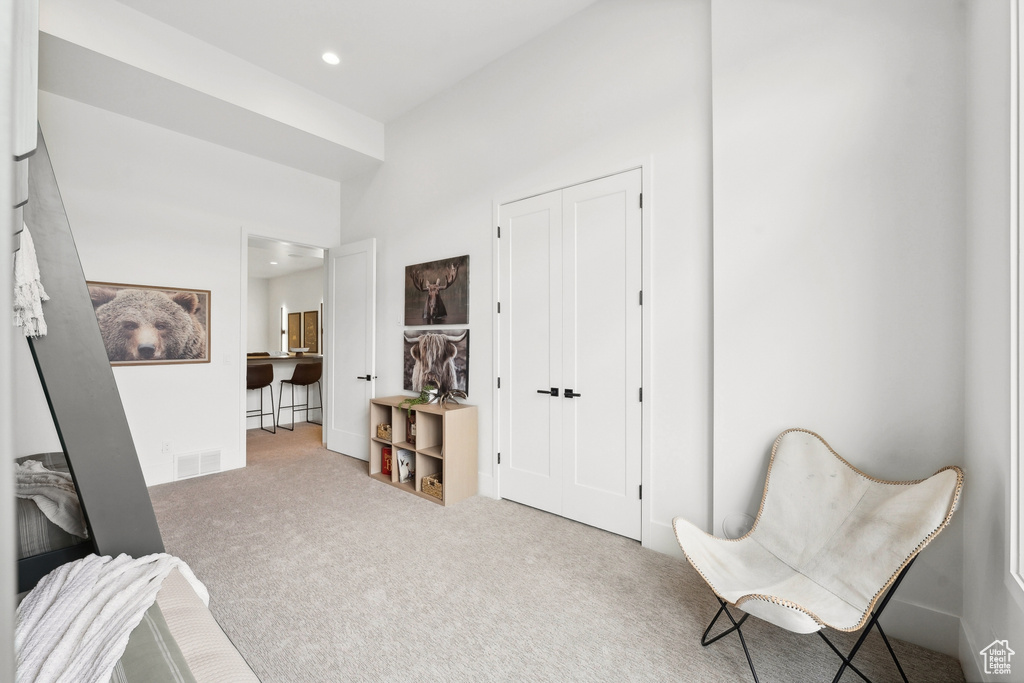 Sitting room with carpet flooring