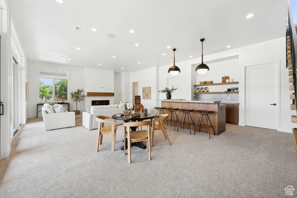 Carpeted living room with bar