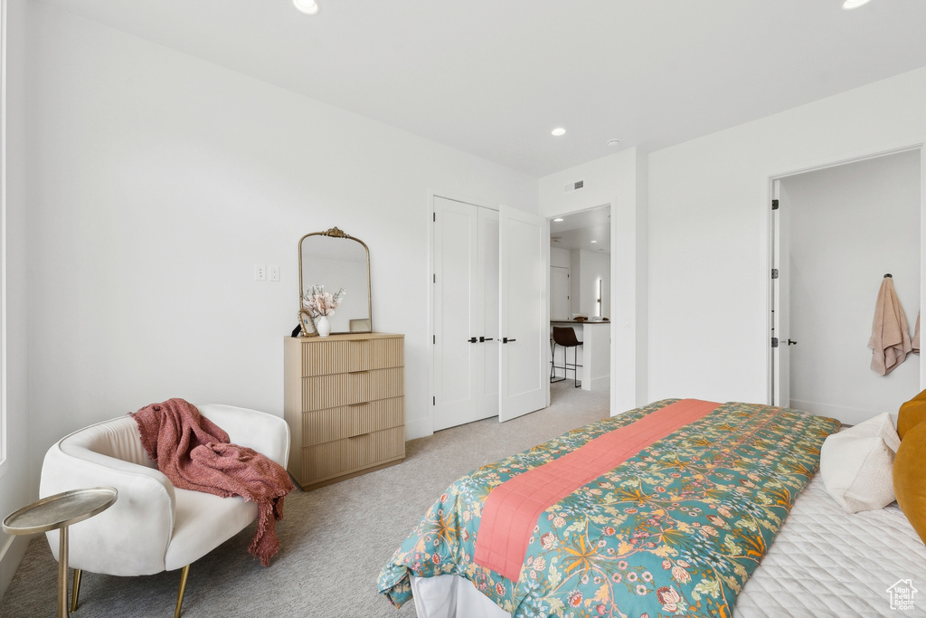 Bedroom featuring a closet and carpet floors