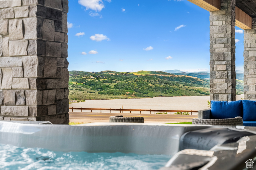 View of pool with a mountain view