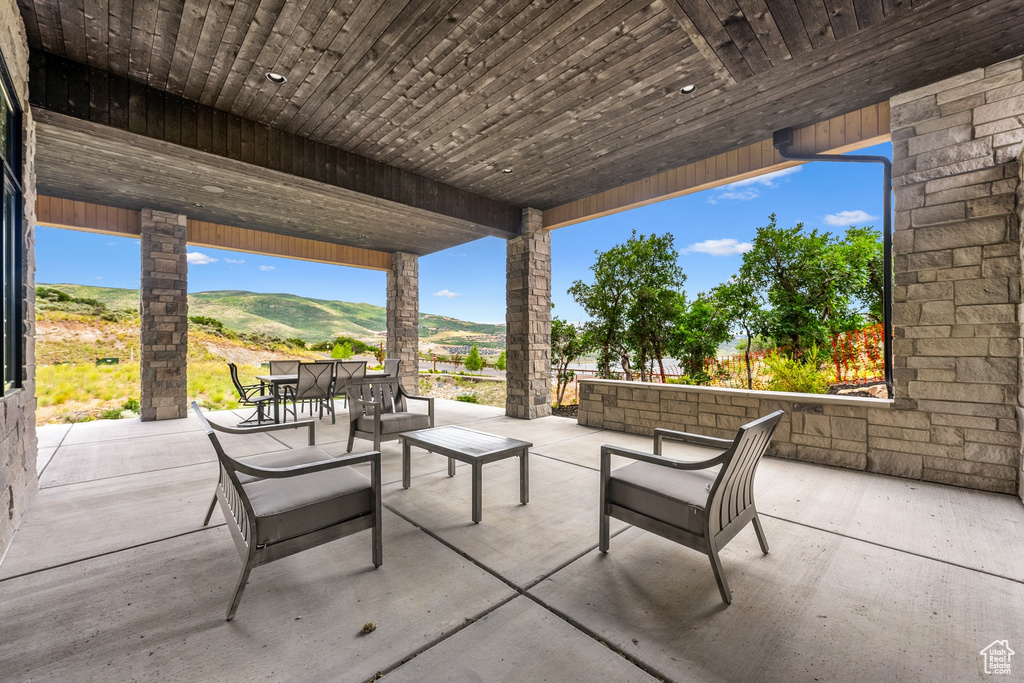 View of patio / terrace with outdoor lounge area and a mountain view