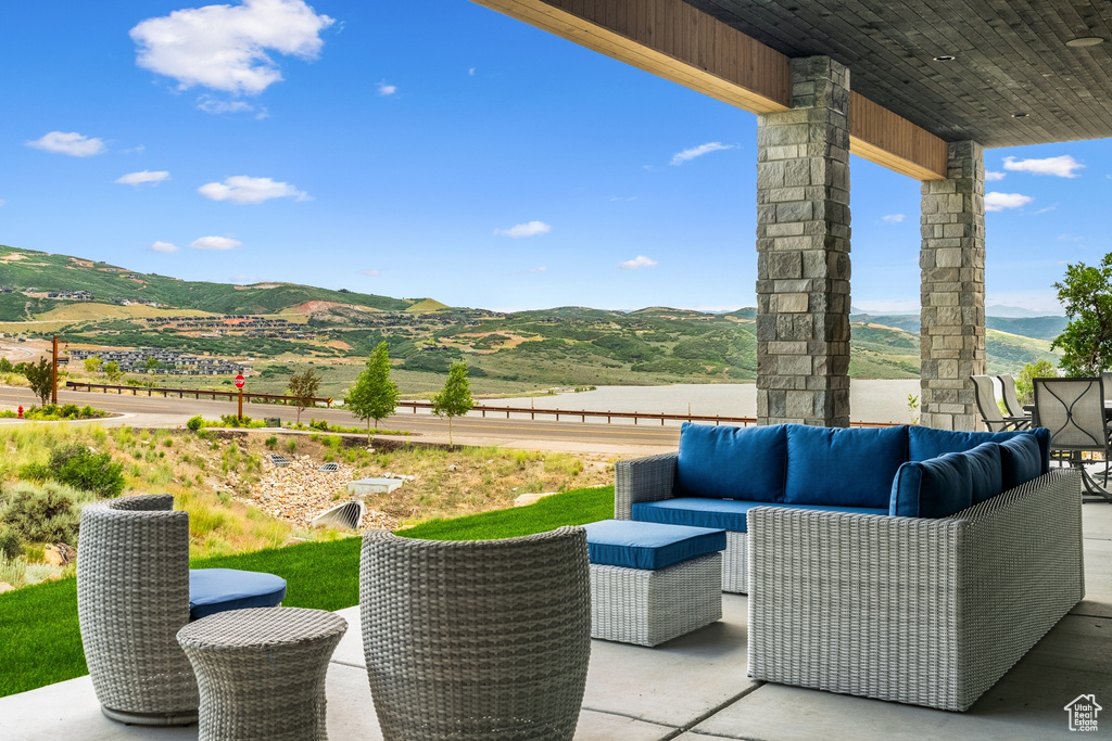 View of patio / terrace with a mountain view and an outdoor living space