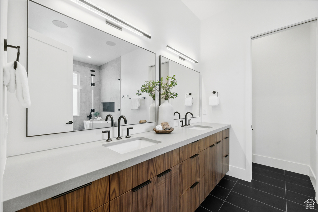 Bathroom featuring dual vanity and tile patterned flooring