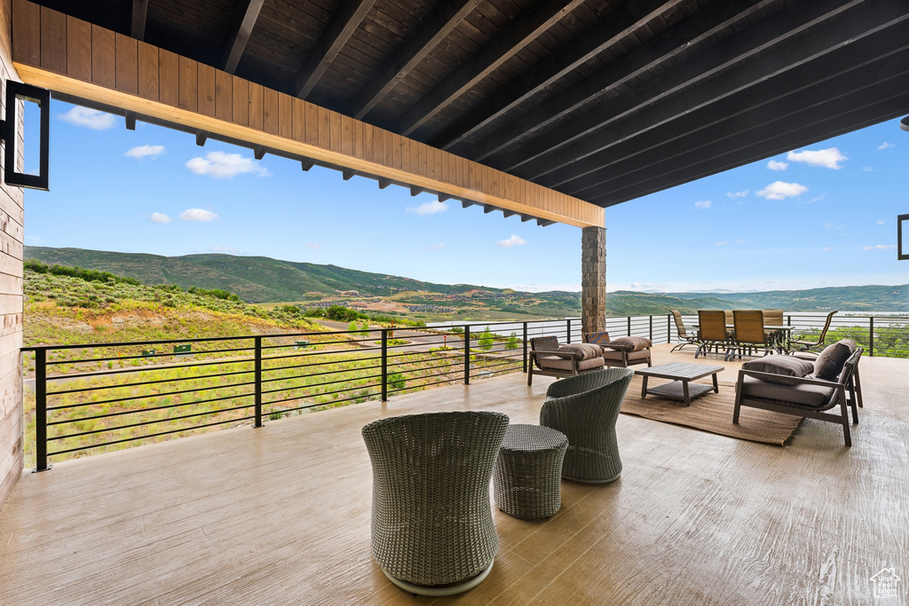 View of patio / terrace featuring a balcony, outdoor lounge area, and a mountain view