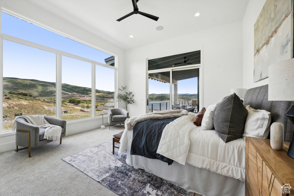 Bedroom featuring access to outside, carpet, and ceiling fan