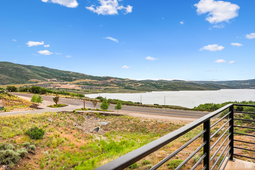 Property view of mountains with a water view