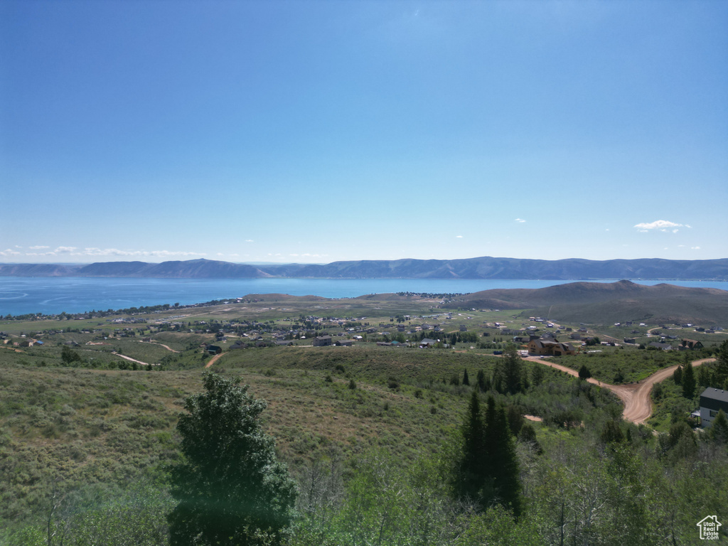 Property view of mountains with a water view