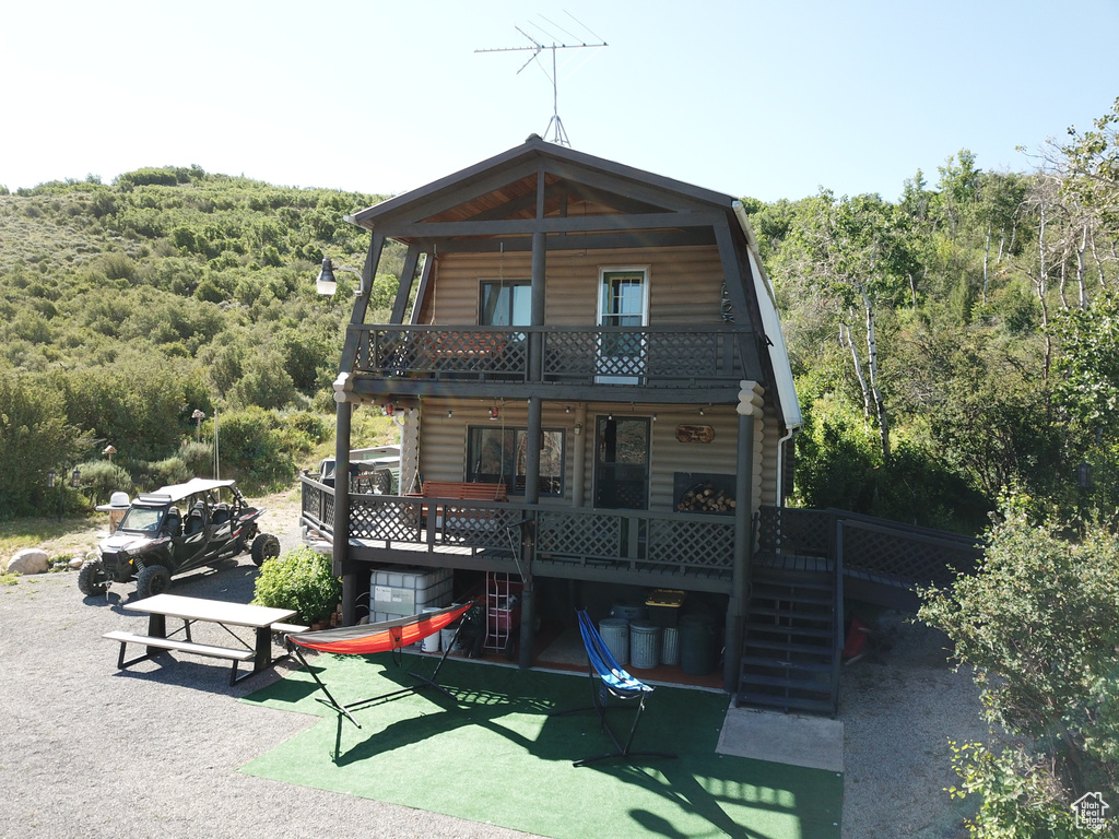 Exterior space featuring a balcony