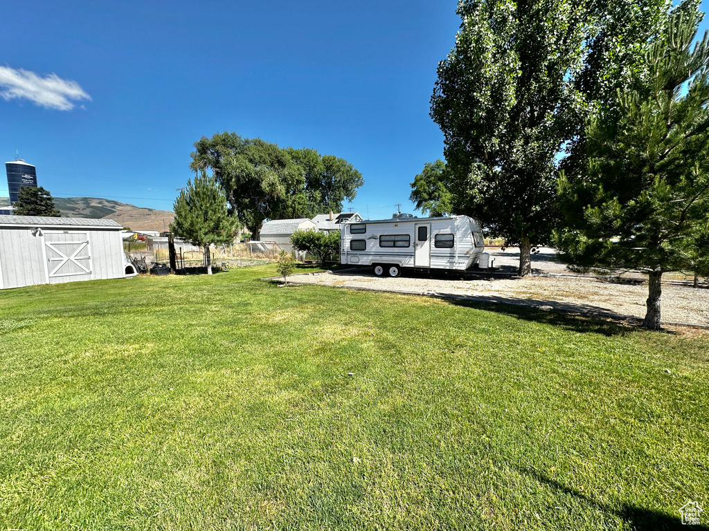 View of yard with an outbuilding