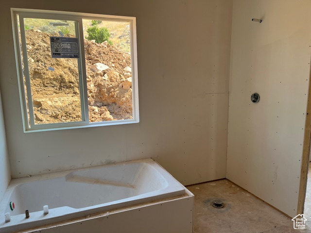 Bathroom with a relaxing tiled tub