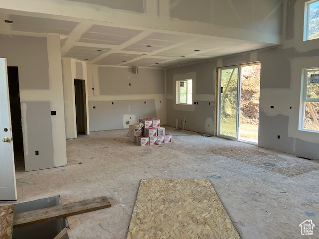 Unfurnished living room with a wealth of natural light