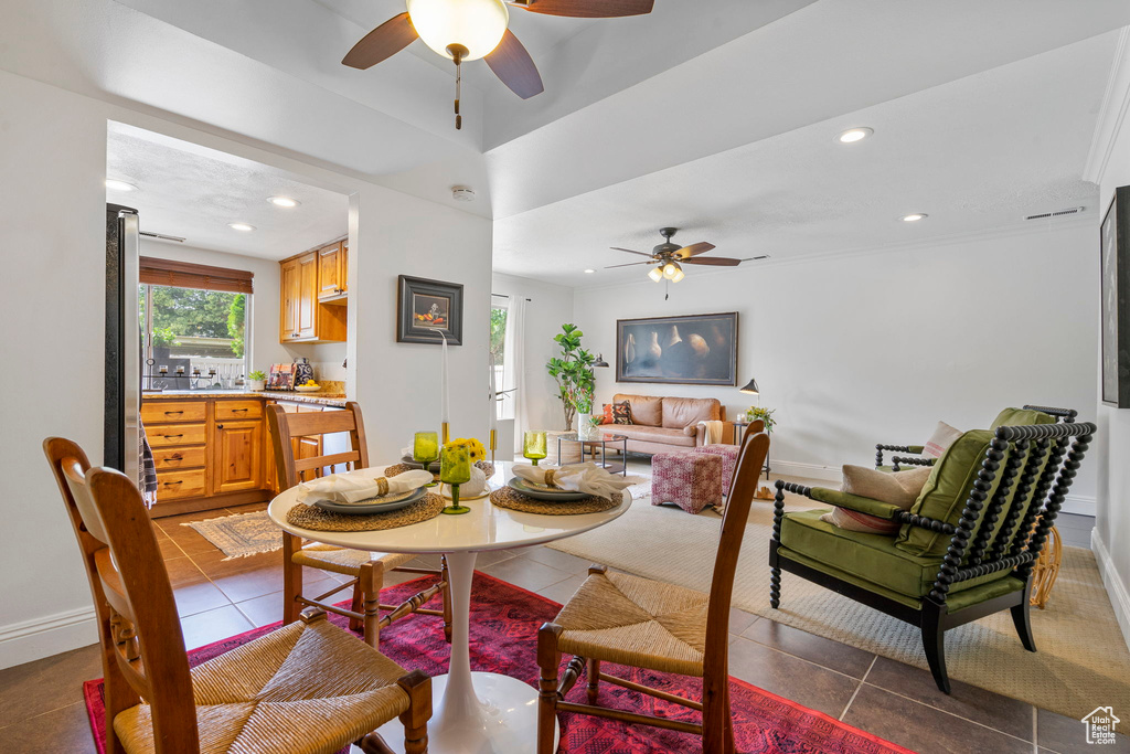 Tiled dining area with ceiling fan