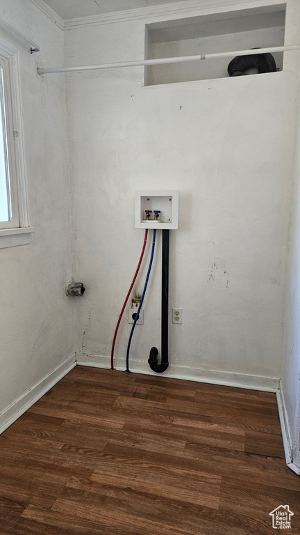 Clothes washing area with wood-type flooring, crown molding, and washer hookup