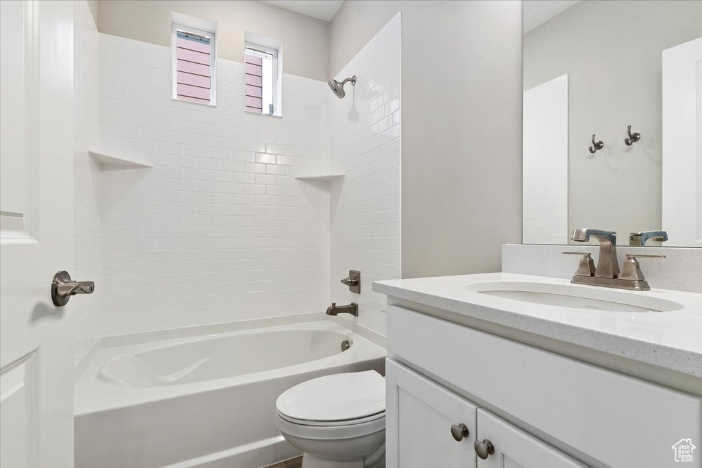 Full bathroom with  shower combination, toilet, and vanity